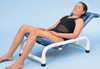Duralife adjustable bath chair with woman in black bathing suit reclining in chair