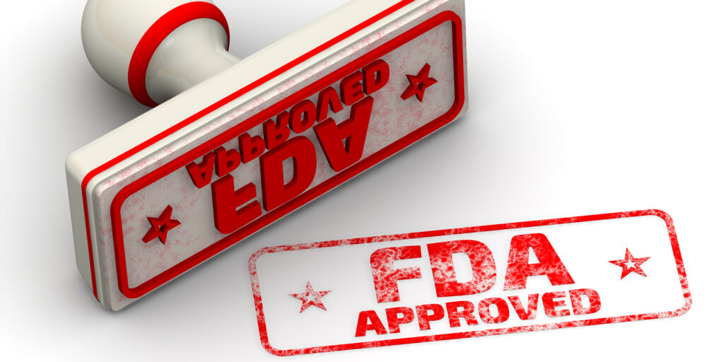 Red seal and imprint "FDA APPROVED" on white surface. FDA - Food and Drug Administration is a federal agency of the United States Department of Health and Human Services. Isolated. 3D Illustration