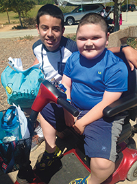 Christopher (right), a six-time camper, has made lifelong friends at camp.