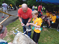 Mason (right) gains confidence at camp.