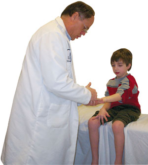 Neurologist Michael Shy examines Justin Wilton, 6, who may have CMT. A diagnostic workup for this disorder generally includes a careful family history, a physical exam, measurements of the speed and intensity of nerve impulses traveling between the spinal cord and muscles, and DNA testing.