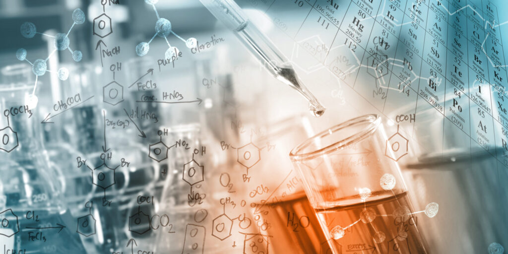 researcher dropping the clear reagent into test tube with periodic table and chemical equations background, for reaction testing in chemical laboratory.
