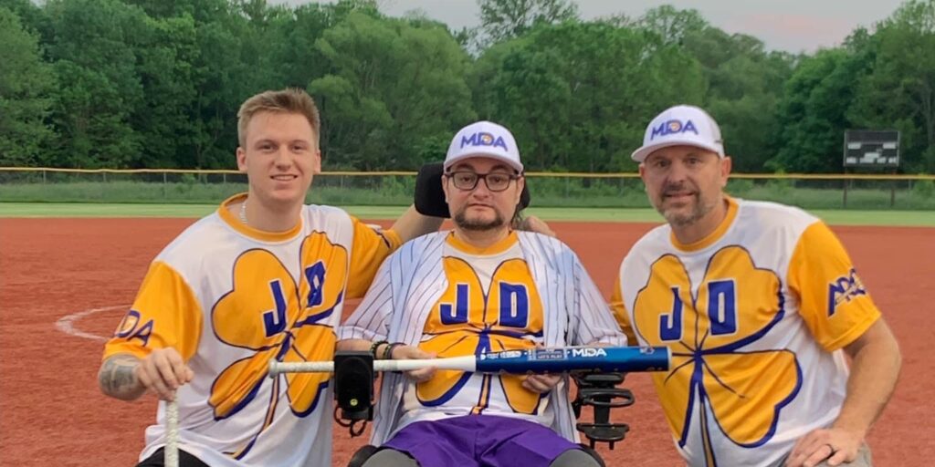 Joey and two teammates with bat