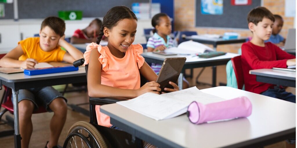 disabled-african-american-girl-using-digital-tablet-while-sitting-on-picture-id1332306879 (1)