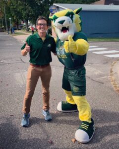 Jason poses with mascot at Northern Michigan University.