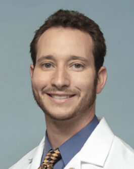 Headshot of Dr. Craig Zaidman, a white man with dark brown hair.
