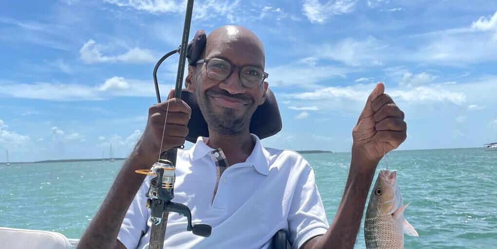 Ira Walker poses on a boat during a fishing trip