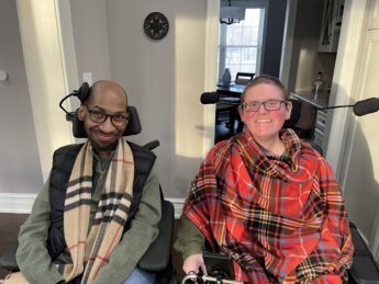 Ira Walker and friend Troy in their power chairs