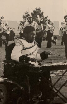 High school yearbook photo of Ira Walker playing the Xylophone in the school marching band.