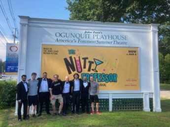 Cast of Nutty Professor standing in front of sign for Ogunquit Playhouse in Maine