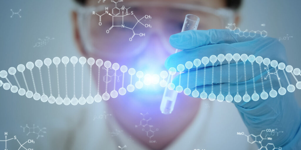 Graphic of DNA double helix on top of scientist with gloved hand holding a test tube
