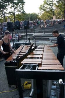 Peter Saleh and another musician play the marimba outside in New York City
