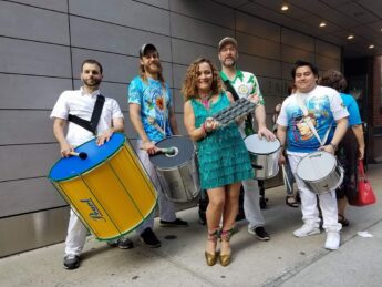 Peter Saleh and members of his Samba Group pose with instruments
