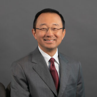 Headshot of Peter Kang, MD, an Asian man with short black hair and rimless glasses.