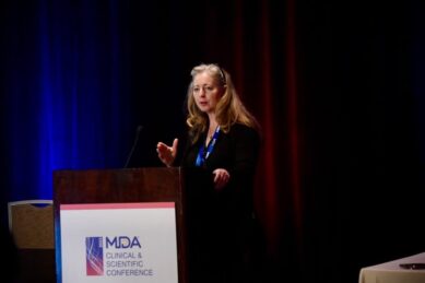 Sharon Hesterlee, PhD, Executive Vice President and Chief Research Officer at MDA, on stage at the MDA Clinical & Scientific Conference