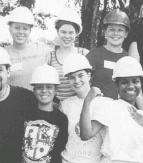 Black and white group photo of Habitat for Humanity volunteers