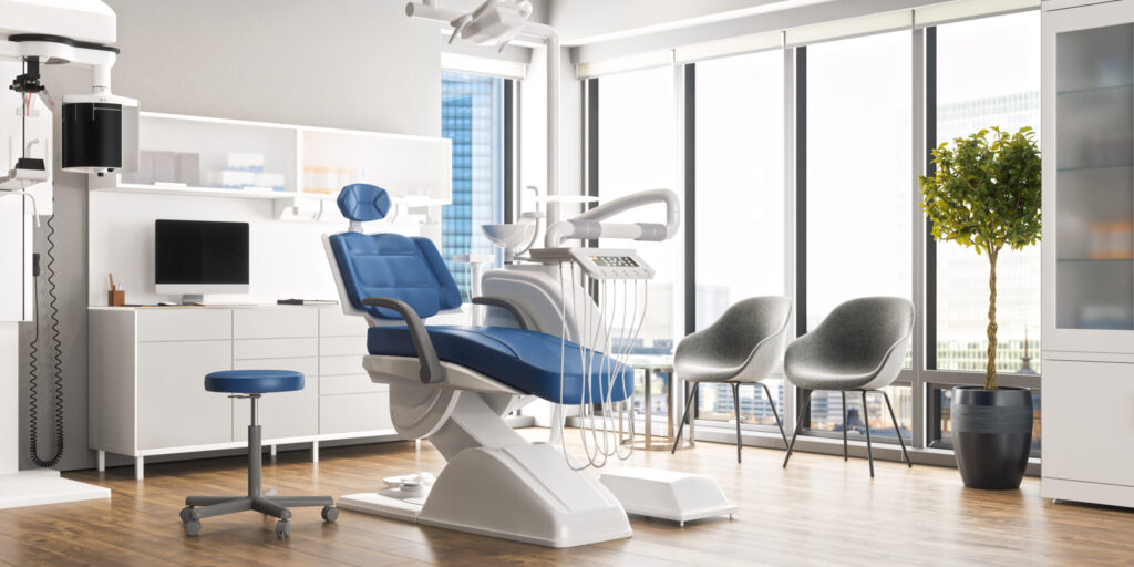 Interior of an empty modern dental clinic room.