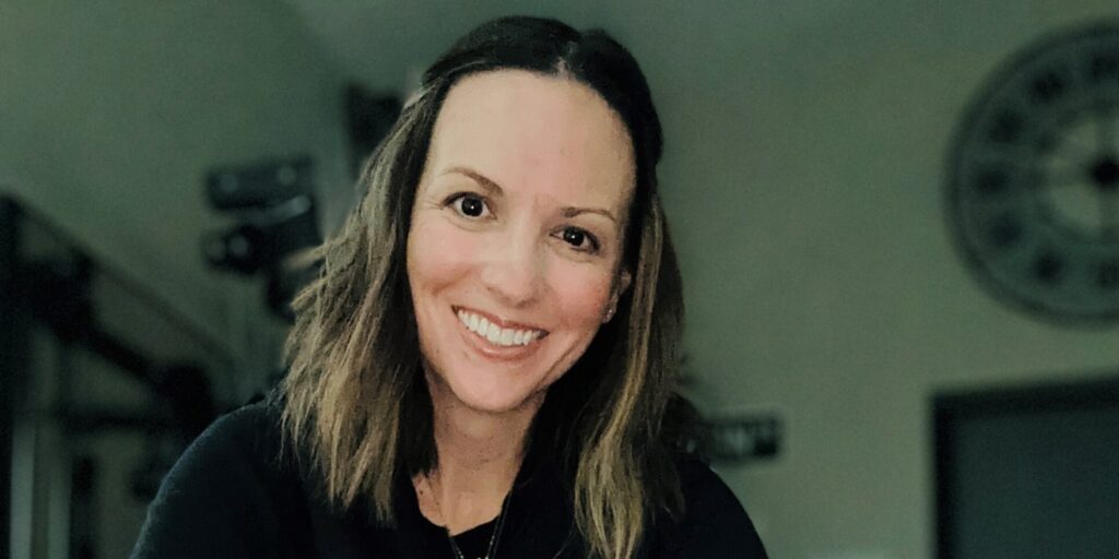 white woman sitting in black clothes