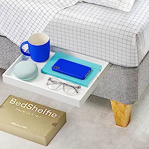 A Bedshelfie with personal items on it