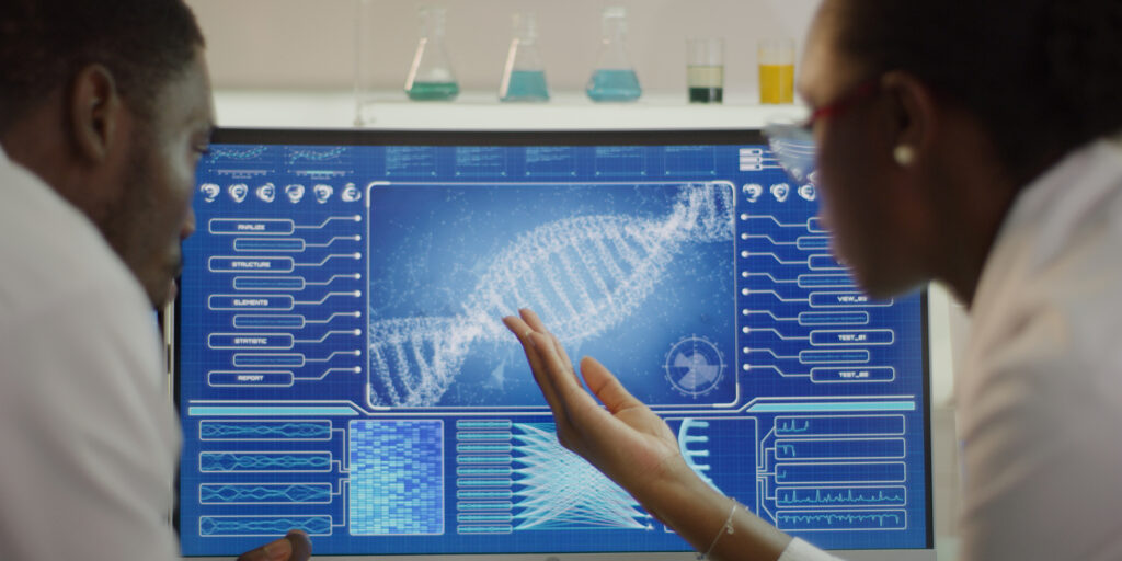 Scientist examines DNA models in modern Genetic Research Laboratory.