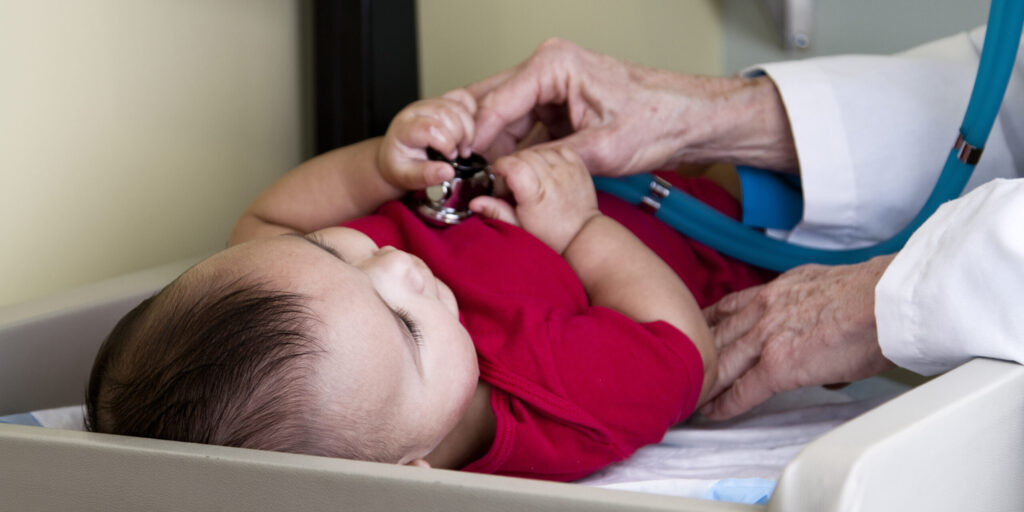 Doctor Using Stethascope on a Baby