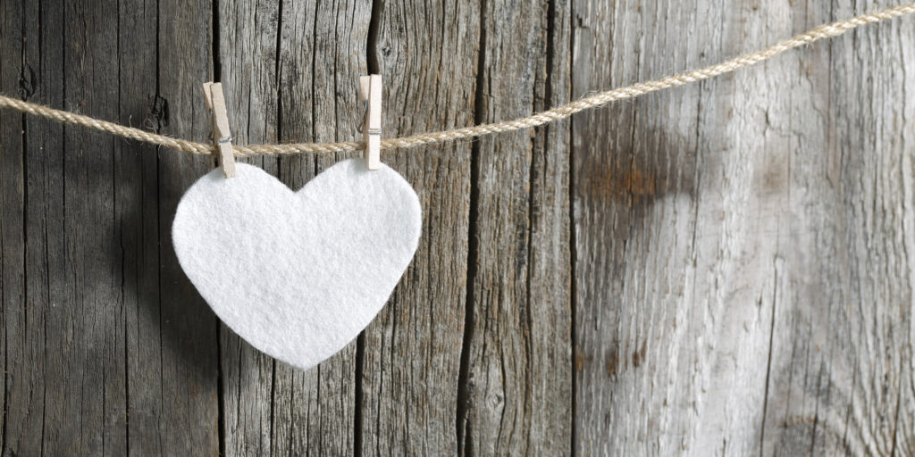 Love heart on Clothesline wood background