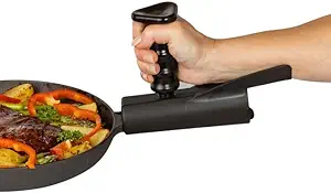 A hand grips a vertical attachment on a pan handle