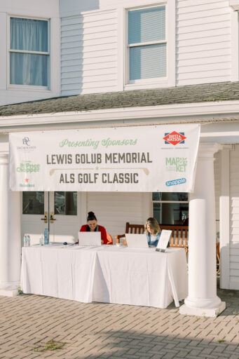 A check in table at the Lewis Golub Memorial ALS Golf Classic