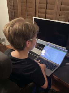 August Johnson using the assistive technology program, Mathcha, to complete homework.