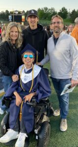 Luke Hennessy with family at his graduation 