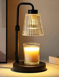 A small lamp shaped candle warmer with a candle 