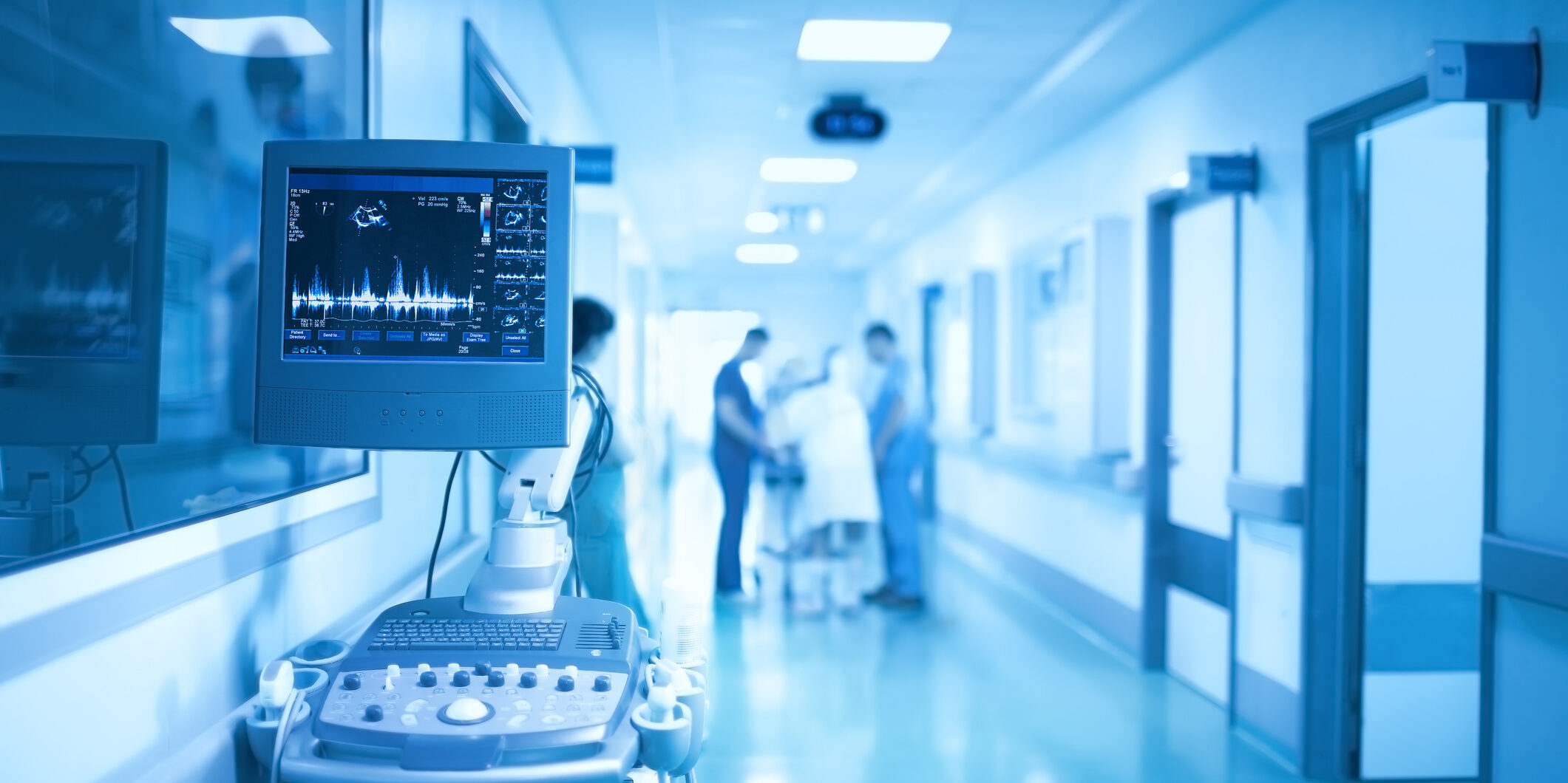 Medical equipment on the background of group of health workers in the ICU.