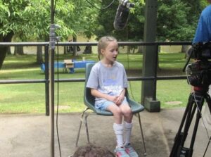 Lily S. during an interview at MDA Summer Camp.