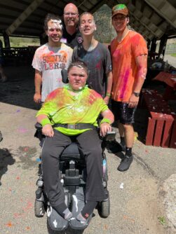 MDA Summer Camp campers and counselors with paint on their clothes
