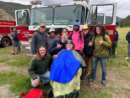 MDA Summer Camp campers and volunteers pose in front of a fire truck