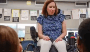 Victoria speaking to a room of students
