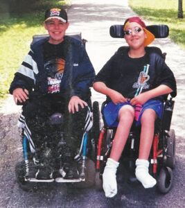 Photo of Isaac Banks and a friend at MDA Summer Camp in the 1980s