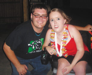 Photo of camper Kelly Berger with counselor Tyler Snow at MDA Summer Camp in 2006