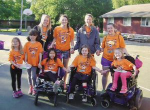 Photo of Sophia Dipasupil with friends at MDA Summer Camp in 2015 