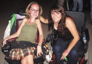 Photo of Sory Rivera and a friend at an MDA Camp dance in the 1990s 