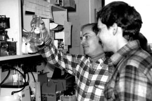 Black and white photo of Louis Kunkel, PhD, who identified the dystrophin gene in 1986, in the laboratory. 