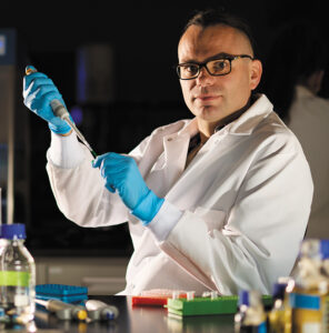Photo of Łukasz Sznajder, PhD, working in his laboratory.