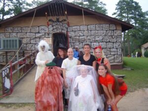 Megan, with friends, dressed as "Cousin It".