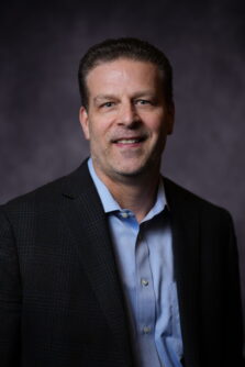 Headshot of Todd Sheets in a black suit coat