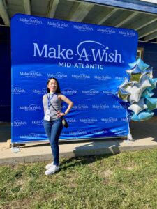 Stephanie at a volunteer event for Make a Wish