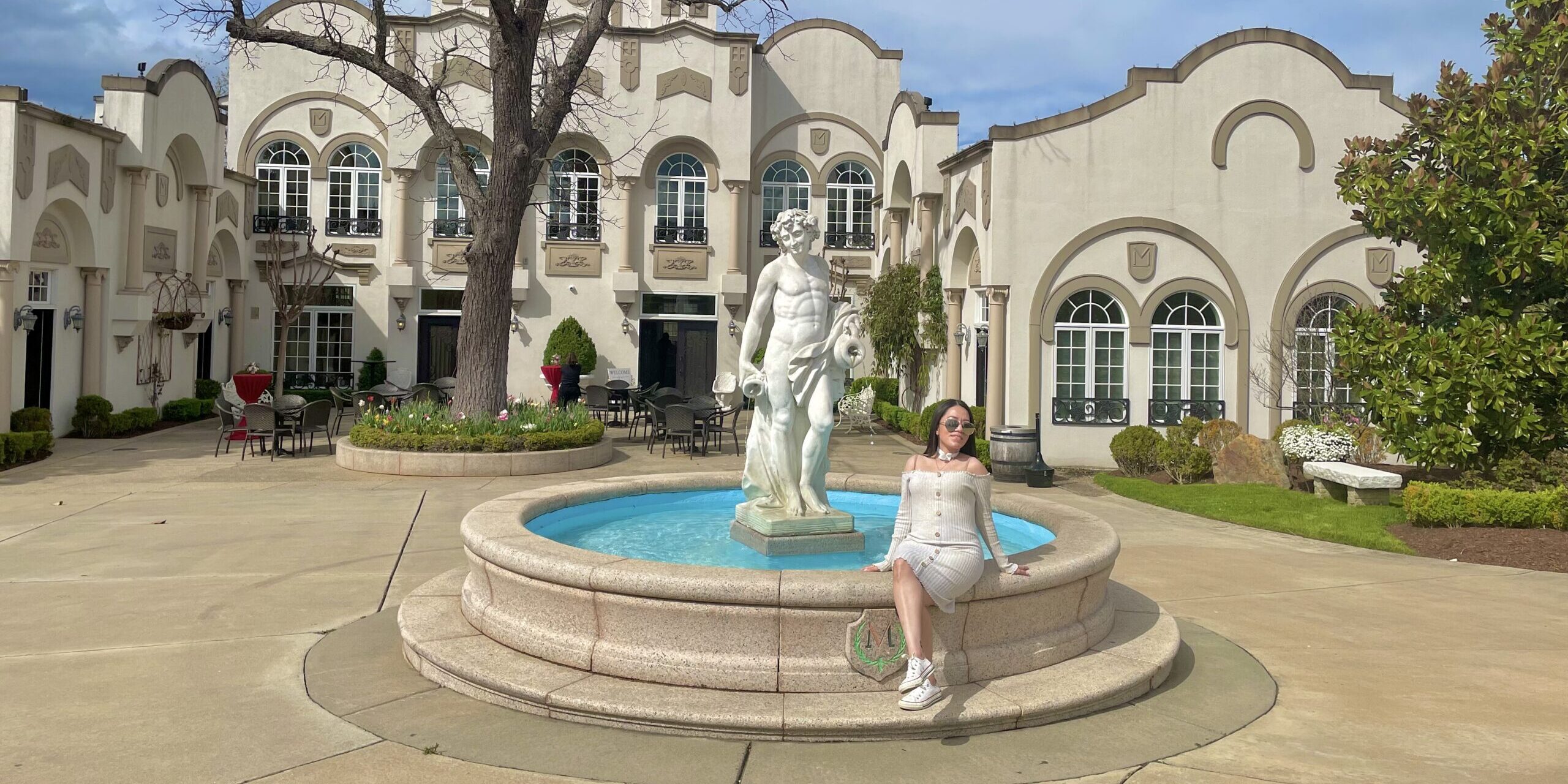 Stephanie sitting outside on a sunny day a local winery in Virginia