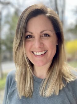 Headshot of Rebecca Hume, a white woman with blonde hair and a brown eyes