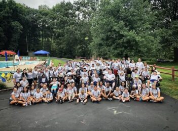 A photo of a large group of campers and volunteers
