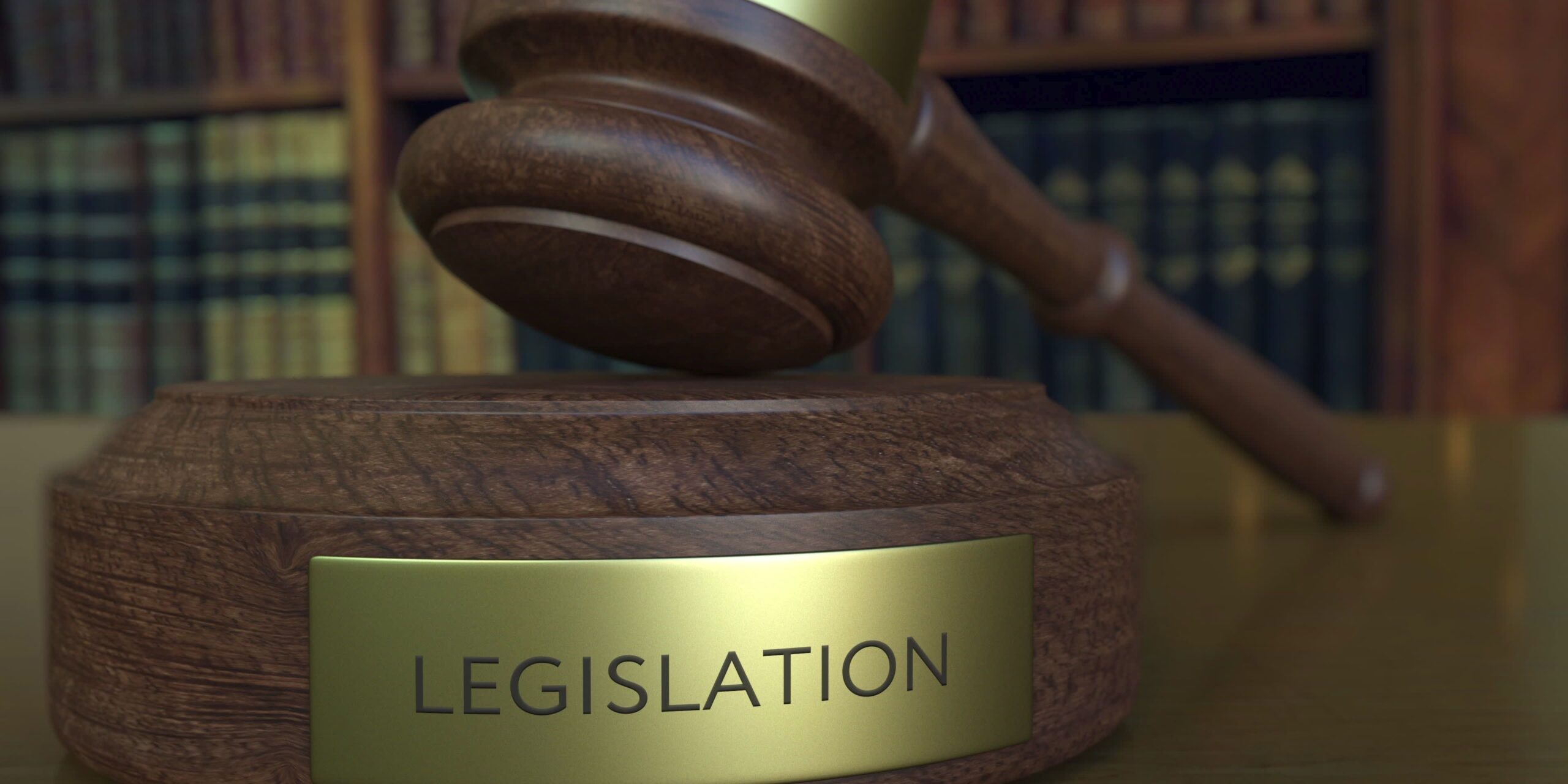 Judge's gavel falling and hitting the block with LEGISLATION inscription. 3D