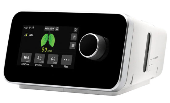 BiPAP device with a touchscreen displaying respiratory settings and a large control dial.